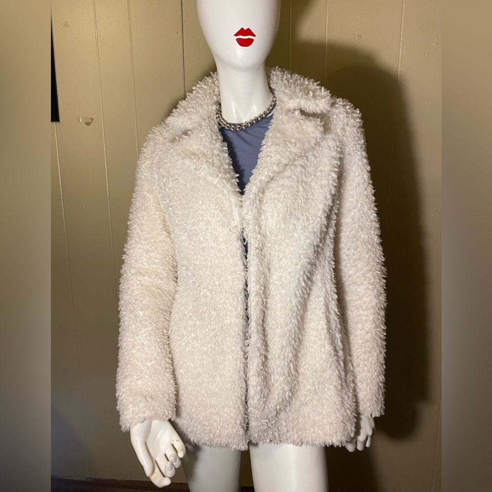 Hip length fuzzy white coat